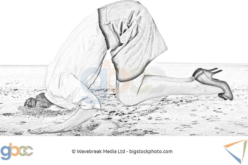 Woman buries her head in the sand.